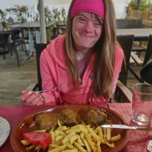Sarah with French Fries and typical Spanish meat